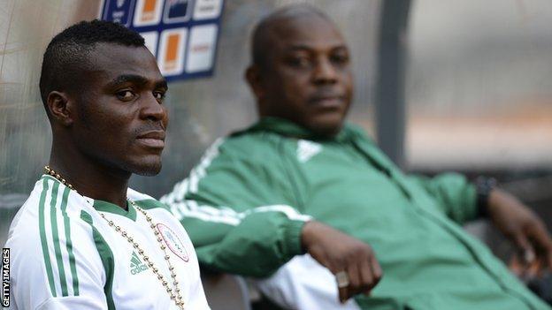 Nigeria's forward Emmanuel Emenike (L) and coach Stephen Keshi