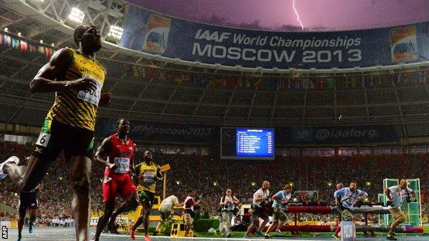 A lightning bolt in the background as Usain Bolt wins