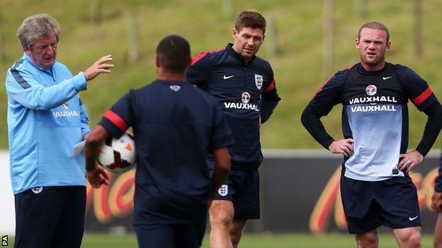 England manager Roy Hodgson (left) and Wayne Rooney (right) during training