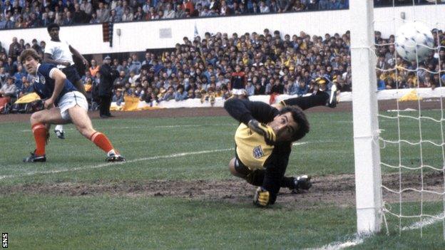 Mark McGhee (left) beats Peter Shilton to open the scoring in a 1-1 draw at Hampden in 1984