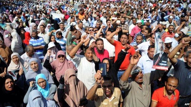 Supporters of the Muslim Brotherhood and Egypt's ousted president Mohamed Morsi chant slogans as they demonstrate in Egypt's northern coastal city of Alexandria