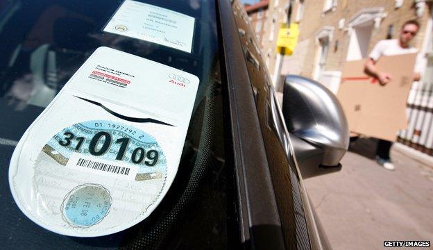 Car tax disc displayed in windscreen