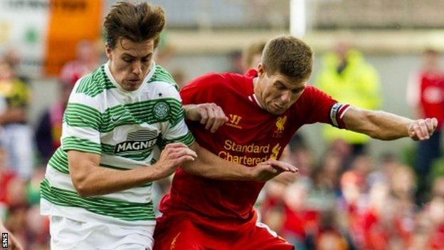 Jackson Irvine tussles with Liverpool's Steven Gerard