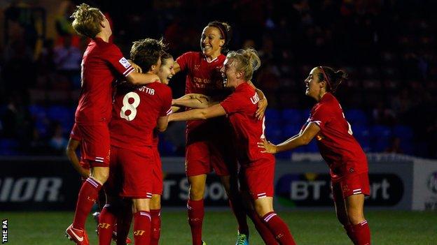 Liverpool players celebrate after scoring against Chelsea