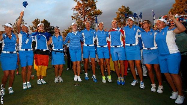 Members of the European Team celebrate after defeating the United States 18-10 in the 2013 Solheim Cup