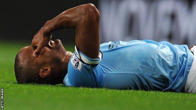 Vincent Kompany awaits treatment for his injury