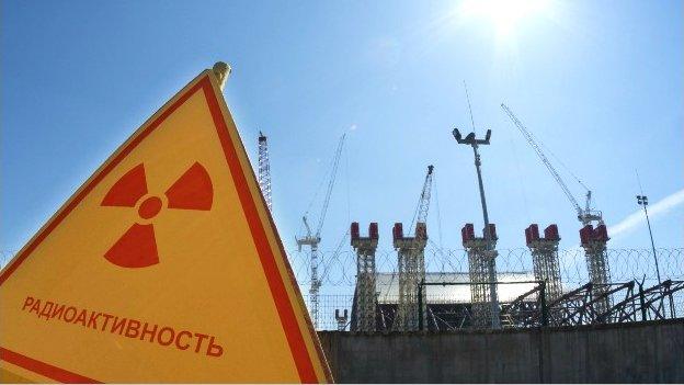 A radiation sign outside a power plant