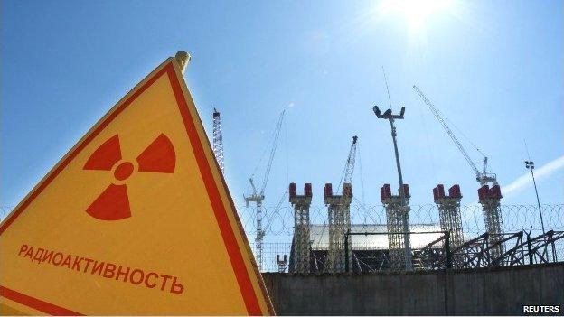 A radiation sign outside a power plant