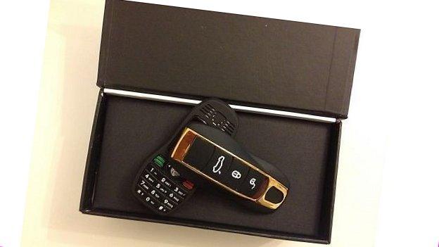 A mobile phone disguised as a key fob