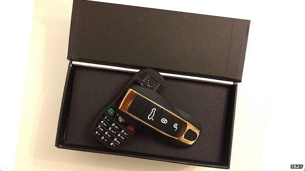 A mobile phone disguised as a key fob