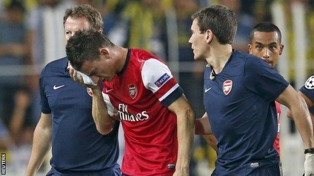 Arsenal defender Laurent Koscielny walks off after suffering his injury against Fenerbahce