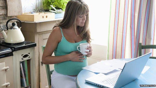 Pregnant woman drinking coffee