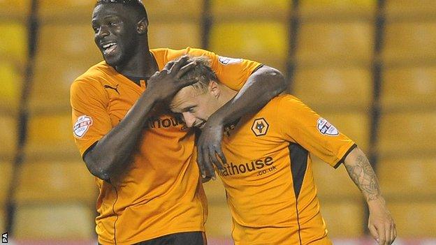 Leigh Griffiths (right) is embraced by Bakary Sako