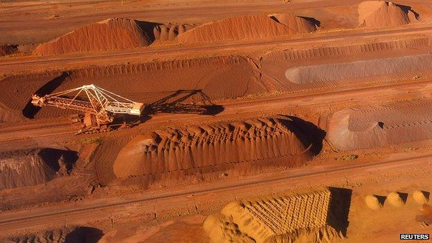 A bucket wheel reclaimer collects ore at the BHP Billiton iron ore loading facility in Port Hedland, about 1,600 km (960 miles) north of Perth, in this 26 May 2008 file photo