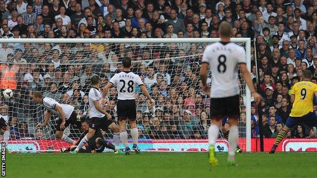 Lukas Podolski (far right) makes it 2-0 for Arsenal against Fulham