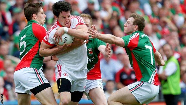 Mayo's Lee Keegan and Colm Boyle with Matthew Donnelly of Tyrone