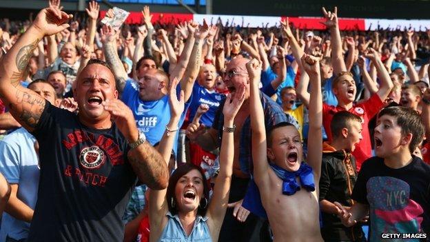 Cardiff fans inside the stadium celebrate a 3-2 win over Manchester City