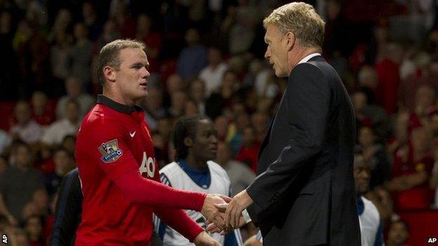 Wayne Rooney (left) shakes hands with David Moyes