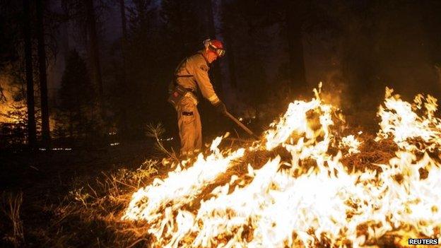 A firefighter battles California's Rim Fire near Yosemite National Park on 26 August 2013