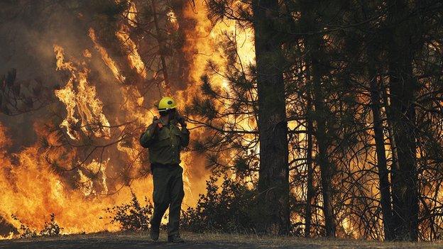 Fireman tackling flames