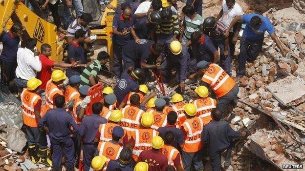 Rescue workers during a search operation for survivors in Vadodara in the western Indian state of Gujarat August 28, 2013