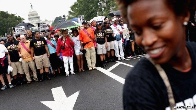 People prepare to march from the Capitol building to the Lincoln Memorial in Washington DC on 28 August 2013