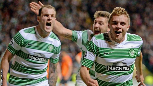 Celtic's James Forrest celebrates his late goal against Shakhter