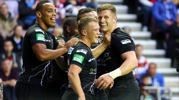 Huddersfield Giants players celebrate a try in the win at Wigan