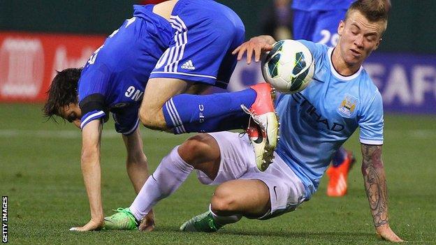 Albert Rusnak (right) battles with Yossi Benayoun