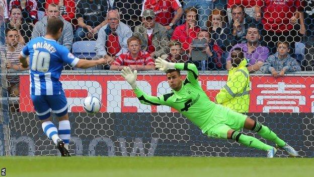 Wigan Athletic's Shaun Maloney scores against Nottingham Forest at the DW Stadium