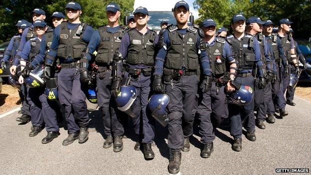 Police guard lorry entering site