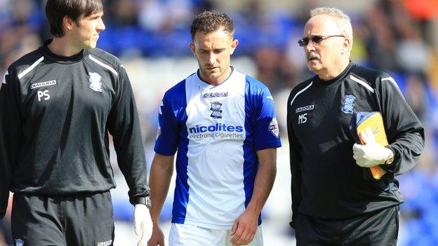 Neal Eardley leaves the pitch after suffering his knee injury against Ipswich