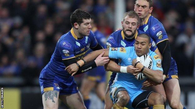 Kevin Penny is surrounded by three Leeds players