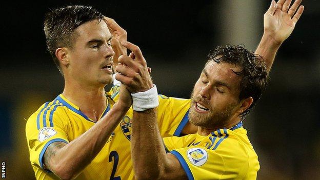 Johan Elmander celebrates his Swedish goal with Mikael Lustig