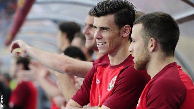 Gareth Bale looks on from the sidelines