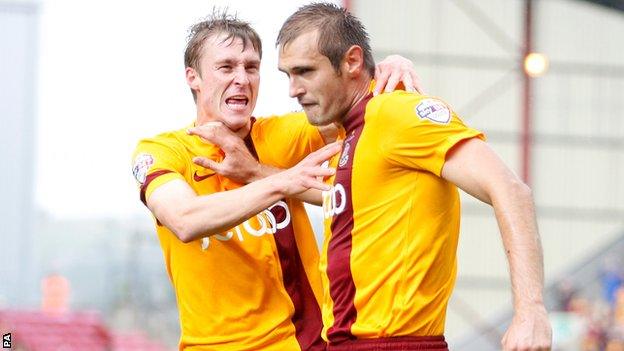 Bradford's James Hanson (right) celebrates his first goal