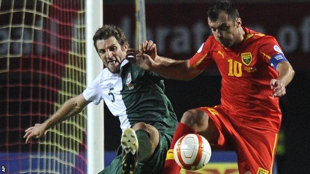 Wales defender Sam Ricketts, left, challenges Macedonia's Goran Pandev