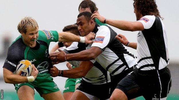 Connacht's Fionn Carr tries to fend off Kameli Ratuvou of Zebre