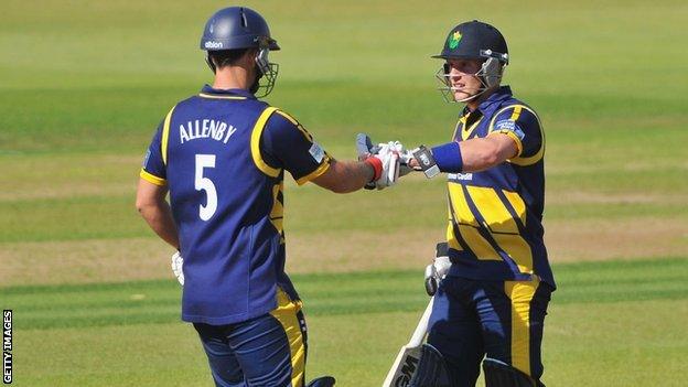 Jim Allenby is congratulated on reaching his 50 by batting partner Ben Wright during Glamorgan's win over Hampshire