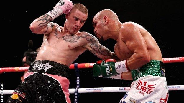 Ricky Burns (left) lands a punch against Raymundo Beltran