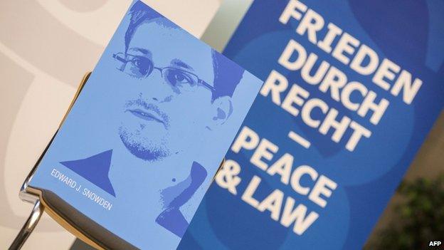 A portrait of Edward Snowden is seen on an empty chair during the Whistleblower Award ceremony at the Berlin-Brandenburg Academy of Sciences in Berlin, on 30 August, 2013