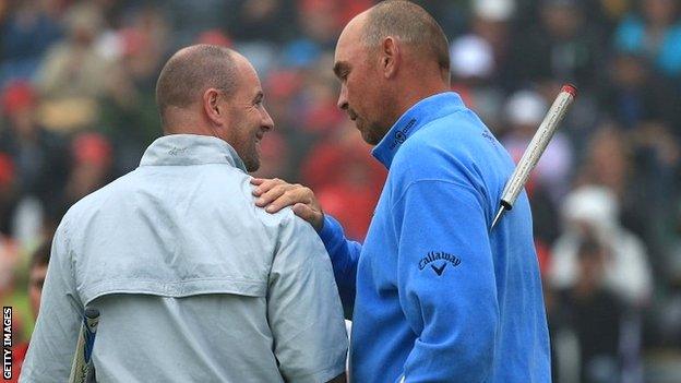 Thomas Bjorn (right) consoles Craig Lee after his play-off win at the European Masters