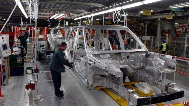 A worker building a Range Rover at the Solihull plant