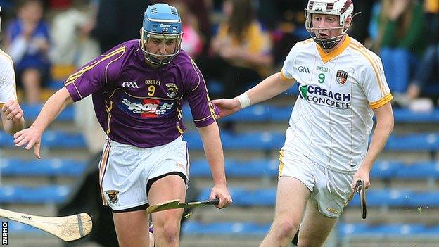 Jackson McGreevy (right) battles with Wexford's Aaron Kenny in the All-Ireland semi-final