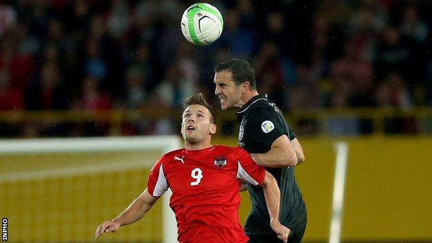 John O'Shea outjumps Andreas Weimann in Vienna