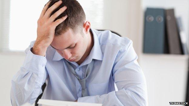 Generic image of a stressed businessman