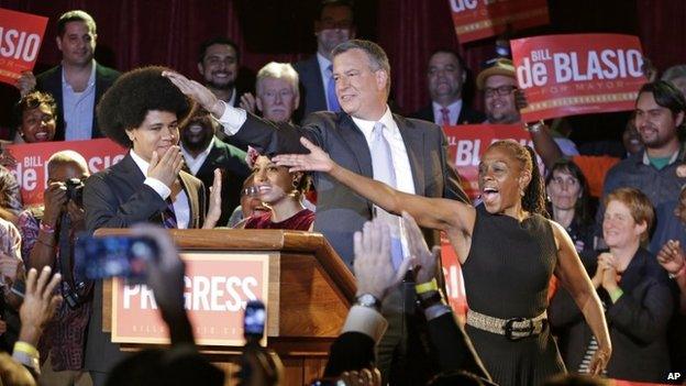 New York City Democratic Mayoral candidate Bill De Blasio his wife Chirlane McCray, right, and son Dante, celebrate after polls closed in New York City's primary election on 11 September 2013