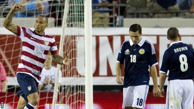 Jermain Jones celebrates scoring against Scotland