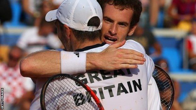 Andy Murray hugs Colin Fleming