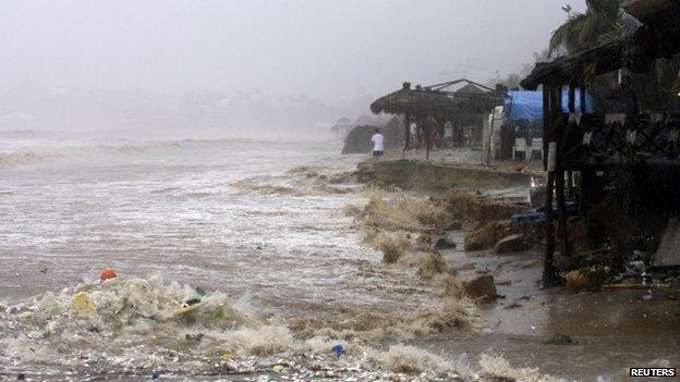 Waves flood a beach in Acapulco on 15 September, 2013